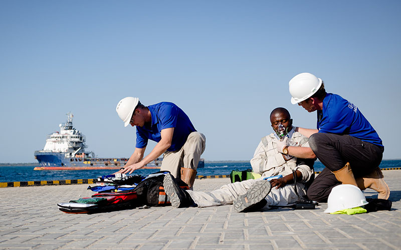 Two medics helping an injured person