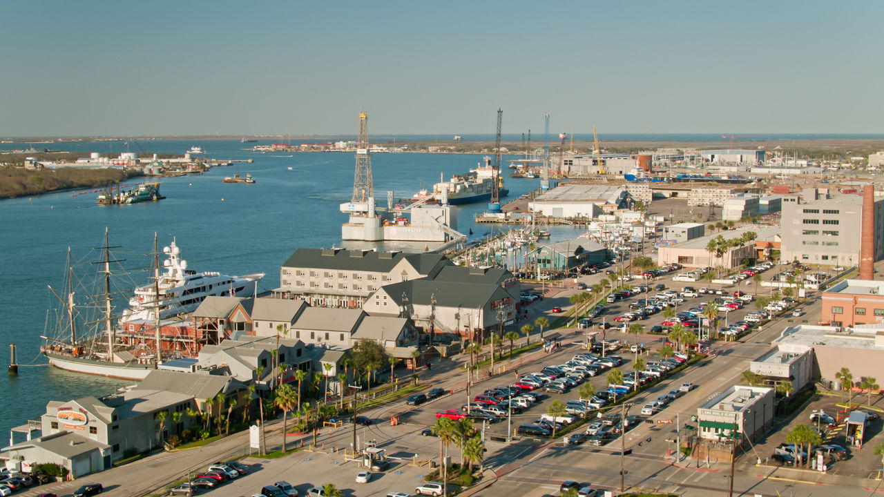 Aerial view of the waterfront in Galveston, Texas on a clear sunny afternoon. 

Authorization was obtained from the FAA for this operation in restricted airspace.